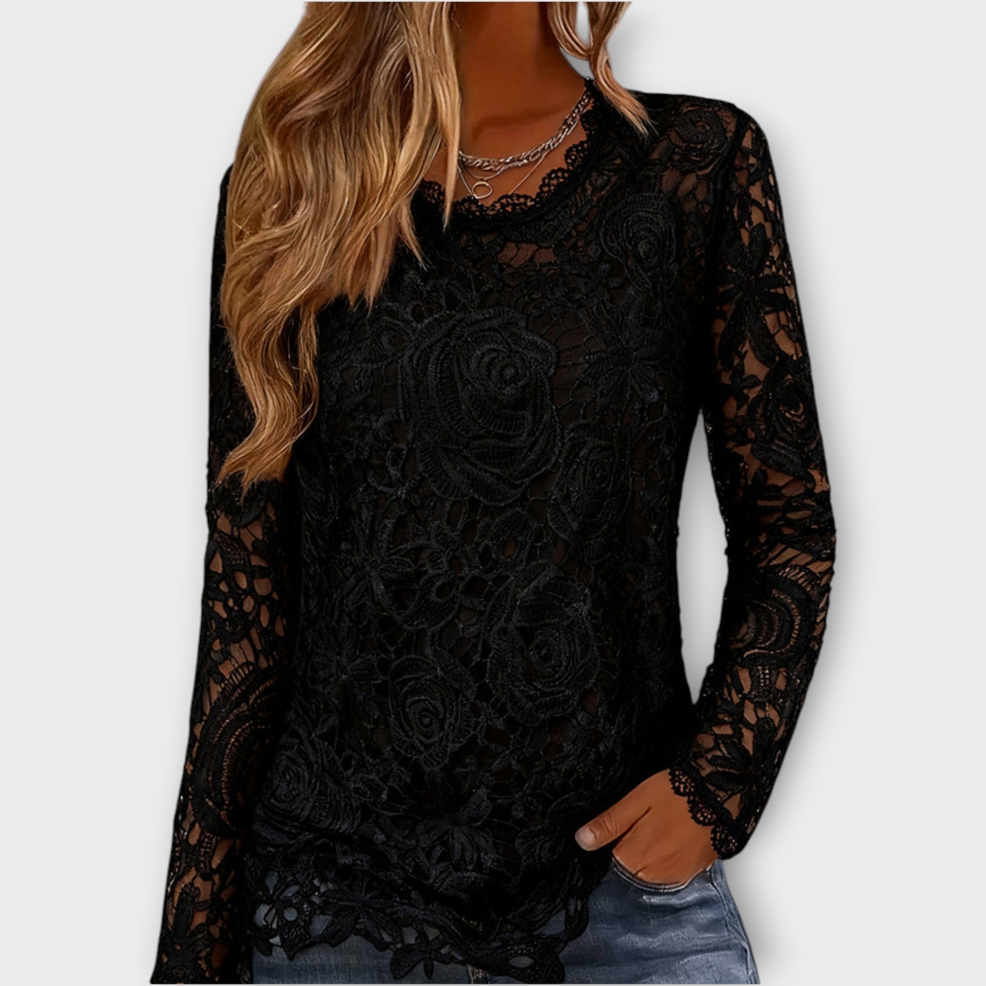 Top elegante in pizzo floreale a maniche lunghe