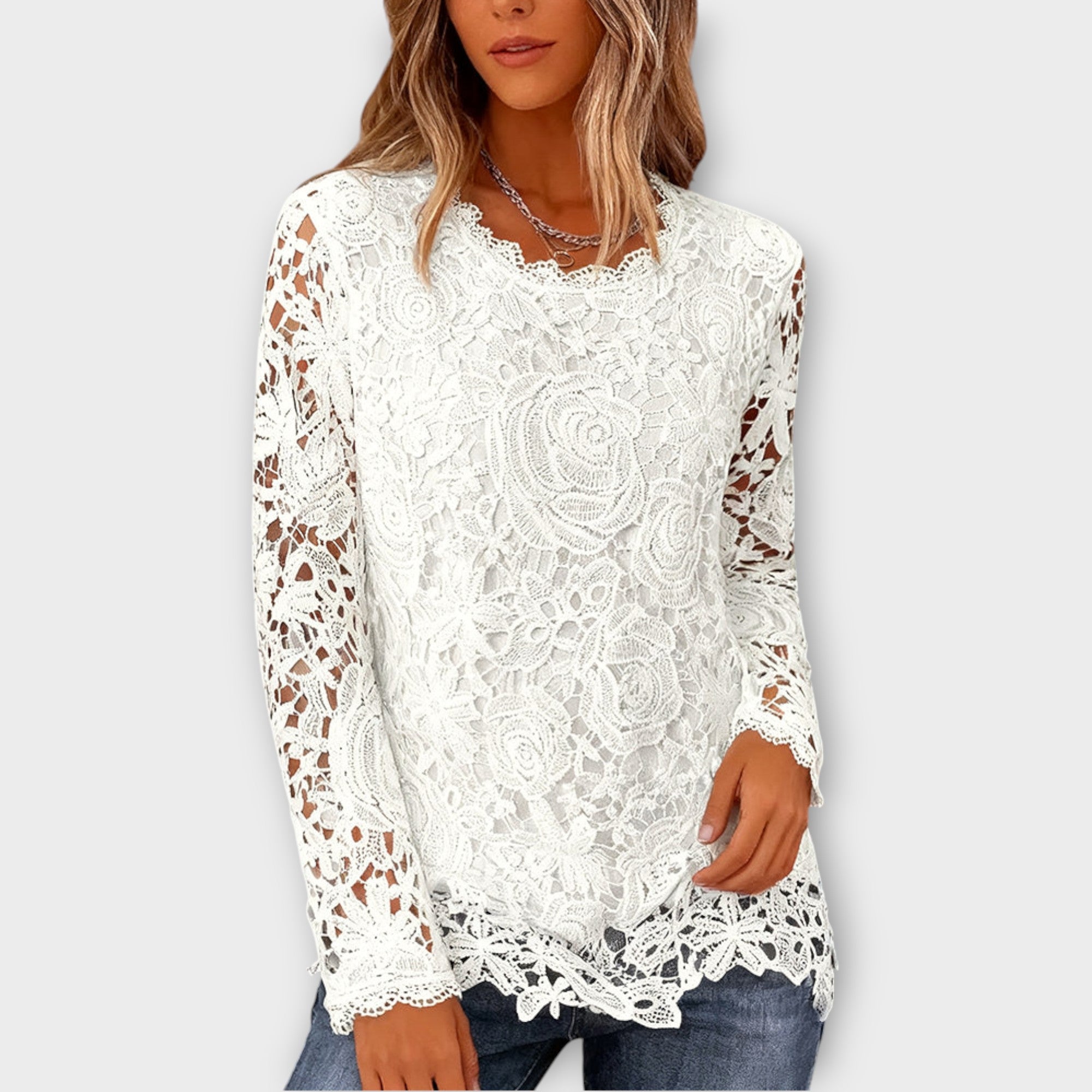 Top elegante in pizzo floreale a maniche lunghe
