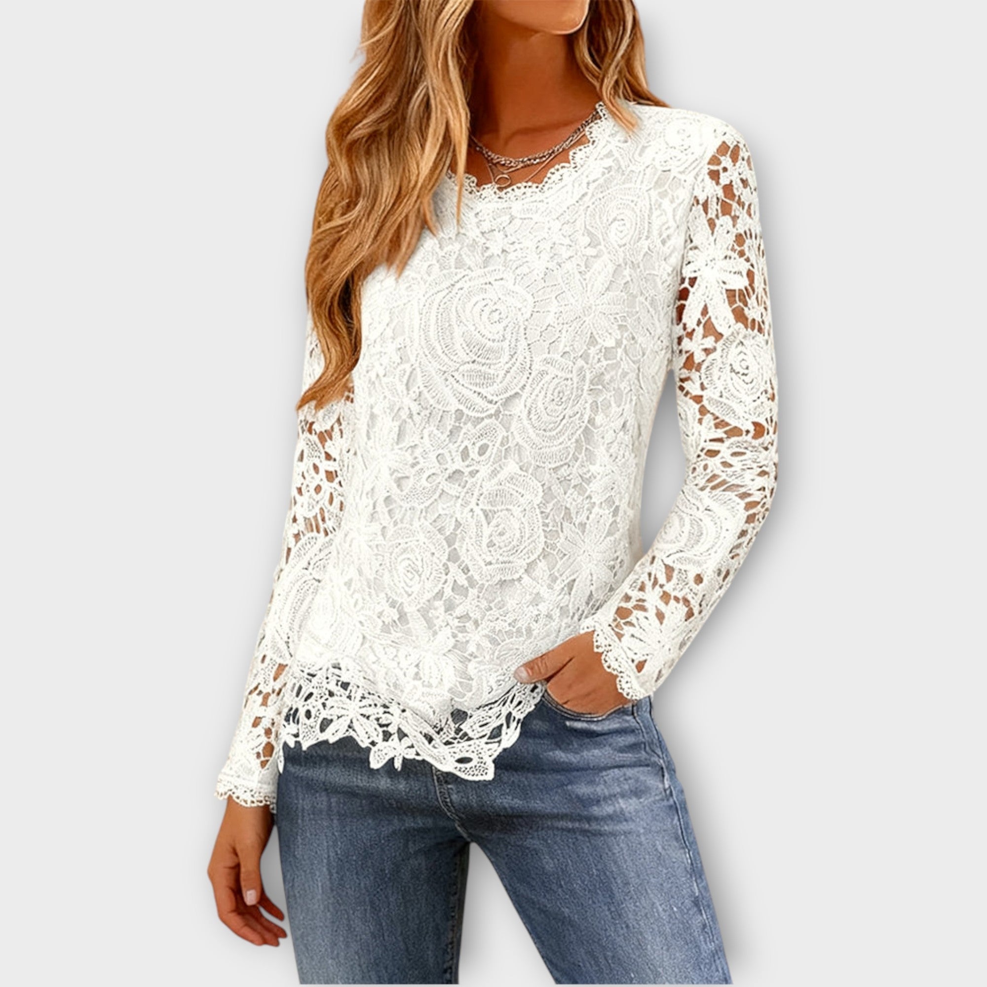 Top elegante in pizzo floreale a maniche lunghe