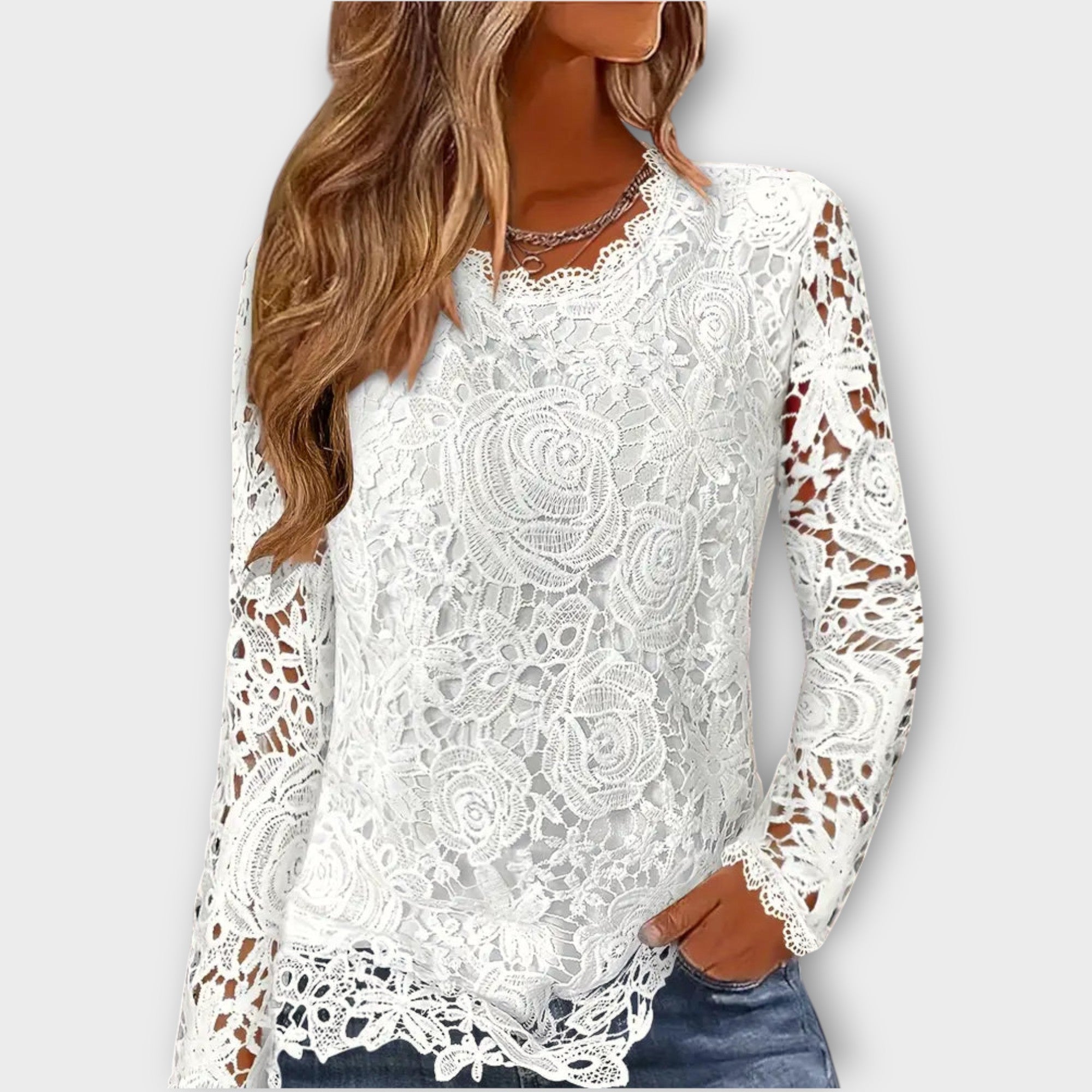 Top elegante in pizzo floreale a maniche lunghe