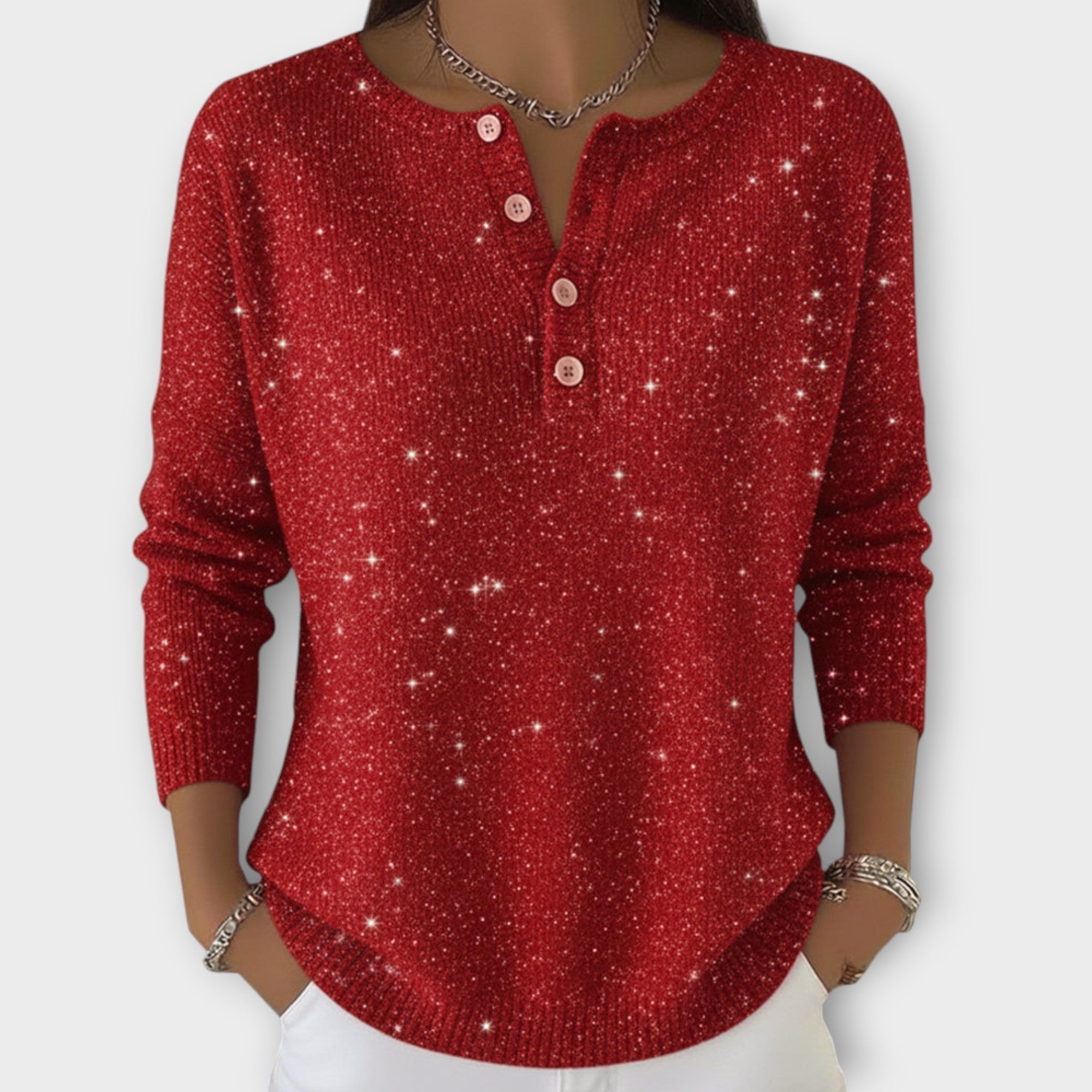 Strikket top med glimmer, knapper og henley-hals